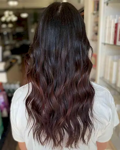 Dark Chocolate Burgundy Balayage Hair with Medium-to-Long Beach Waves