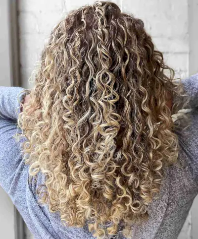 Light Blonde Balayage for Mid Back-Length Layered Curly Hair