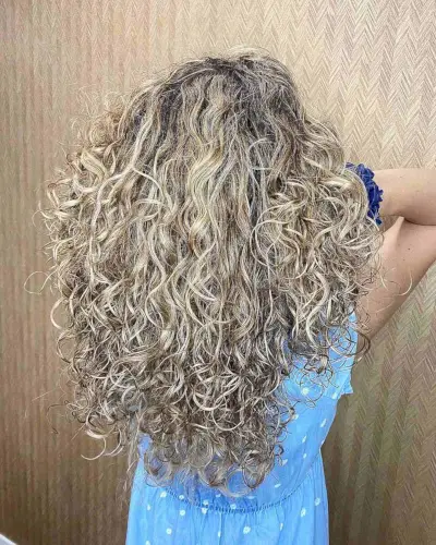 Sun-Kissed Balayage with Long Tousled Curls