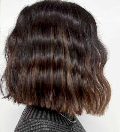 Chic butterscotch balayage on black hair
