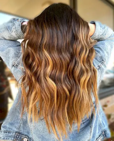 Caramel balayage on romantic brunette hair color