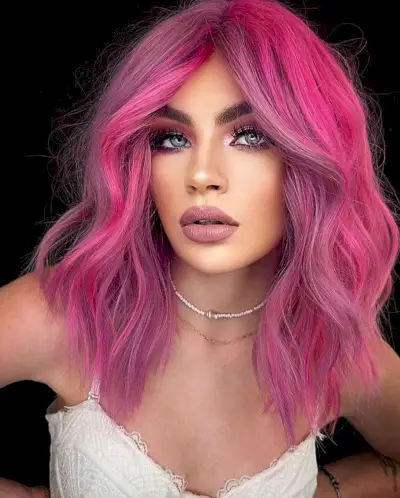 Swoon-Worthy Pink Hair for women with mid-length hair and a middle part
