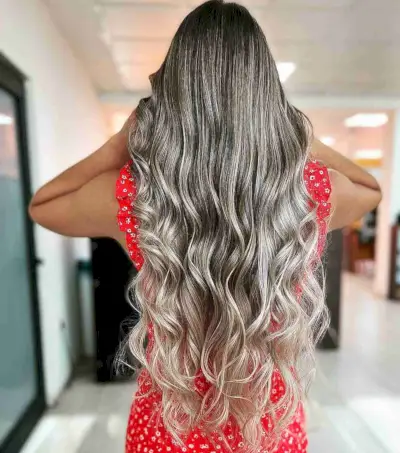 Long Ashy Blonde Balayage with Curled Ends