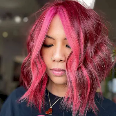 Dark Pink Lob with a Bright Pink Money Piece with choppy ends and no bangs