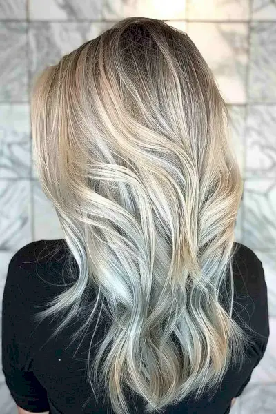 Long layered agate slice hair with silver color and metallic light brown lowlights.