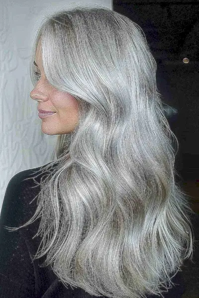 Long layered silver hair with multi-tonal waves
