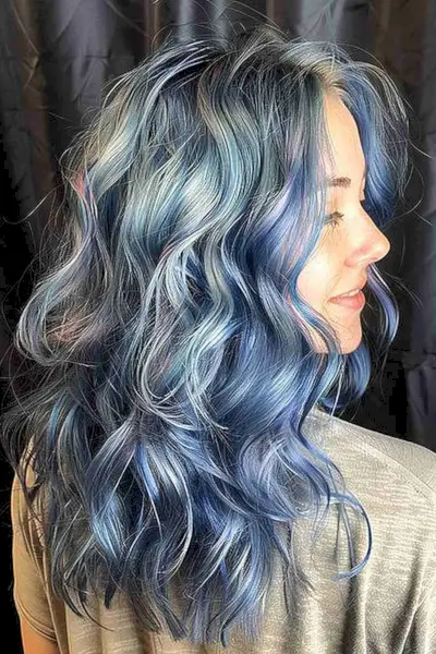 Wavy medium-length hair with gradient of blue shades from deep ocean to sky blue