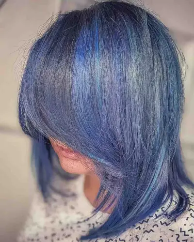 Muted Blue Balayage and Purple Hues on Shoulder-Length Layered Cut