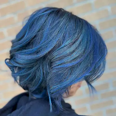Short Dimensional Blue Balayage Bob with Voluminous Waves and Layers