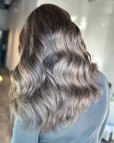 Blended Silver and Mushroom Brown Balayage Hues on Wavy Medium-Length Hair