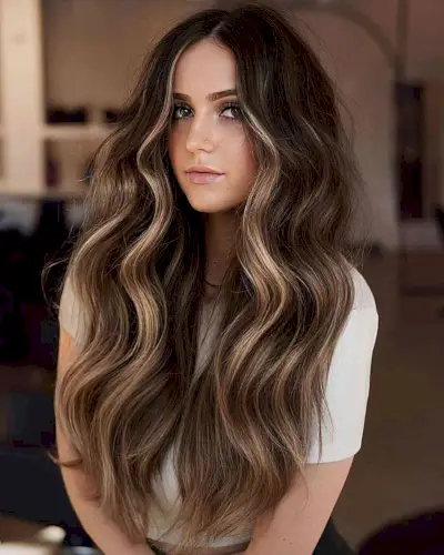 Sultry Long Dark Brown Balayage Hair with a Money Piece and Middle Part