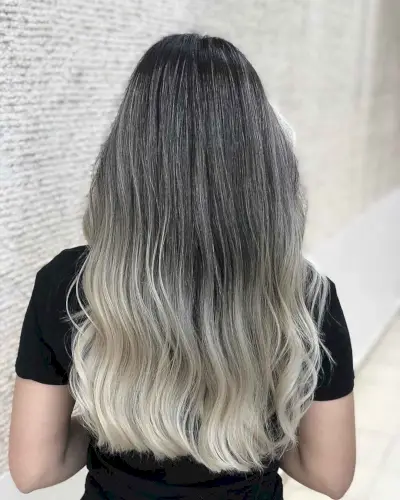 Cool-toned blonde ombre on dark hair