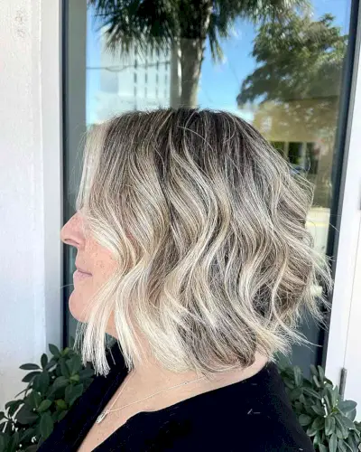 Dark-Rooted Icy Balayage Short Bob with Money Piece