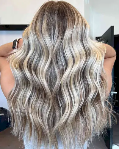 Creamy Icy Blonde Balayage Highlights on Long Light Brown Hair with Choppy Ends