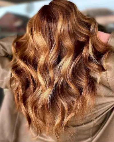 golden caramel color with long loose curls