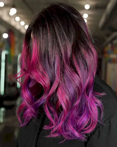 The Hottest Pink to Purple Ombre Colored Hair for women with medium-length hair