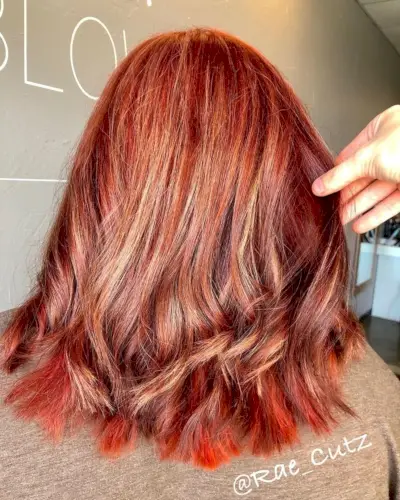 Bold Red hair with red lowlights
