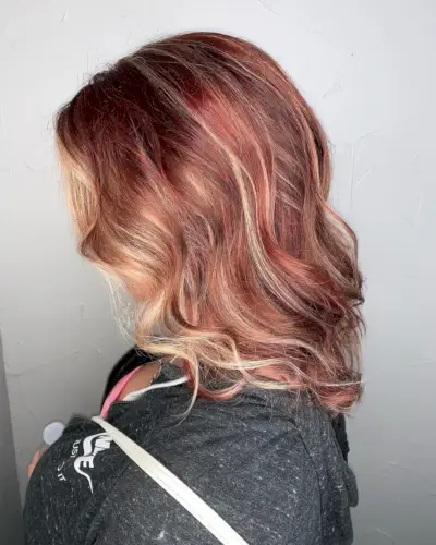 Vibrant Red-blonde hair with highlights