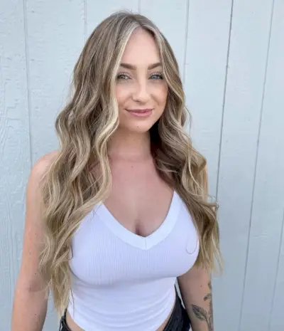 Honey brown hair with face-framing highlights