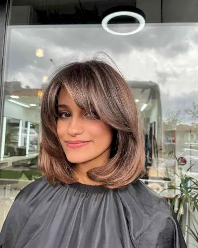 Brunette Balayage Lob with Swoop Bangs for Longer Face Shapes
