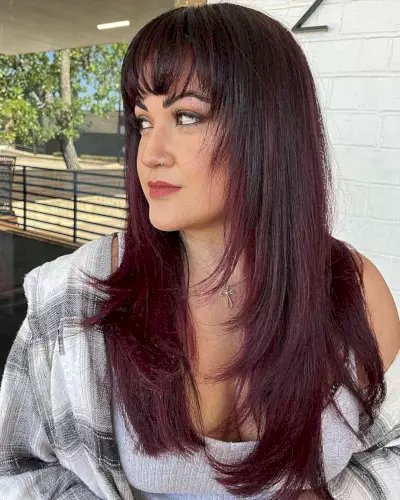 Long Burgundy Balayage Hair with Bangs and Face-Framing Layers