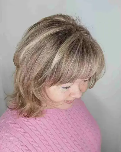 Dimensional Brown-Blonde Balayage Bob with Bangs and Layers for Shoulder-Length Cut 