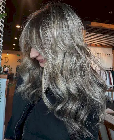 Long Wavy Ash Balayage Hair and Face-Framing Bangs