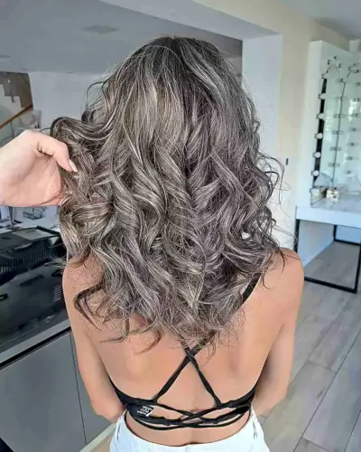 Mid-Long Curled Dark Brown Hair with Blended Grey Highlights