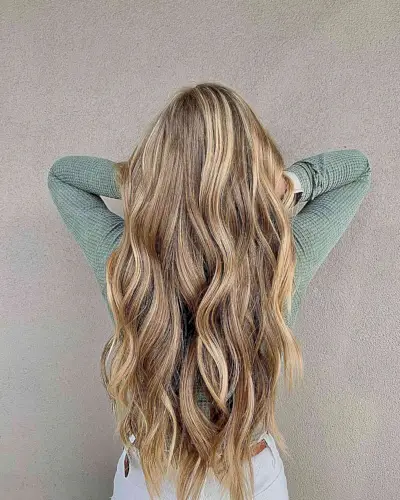 Warm Dimensional Bronde Balayage Hair with Long Waves and Layers