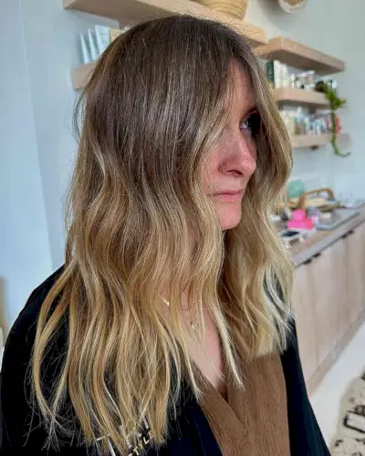 Medium Warm Brown to Blonde Ombre Balayage Hair Styled with Soft Waves