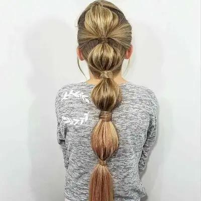 Loose Bubble Braid Hairstyle for Young Girls who Play Softball