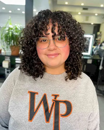 Curly Fringe on a Curly Cut for Full-Faced Women with glasses 