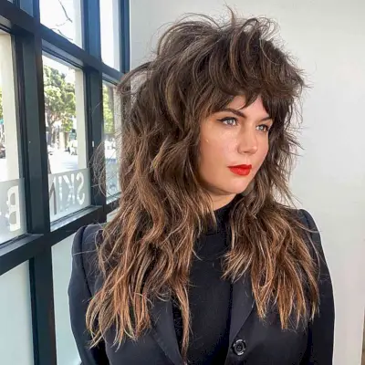 Different Long-Length Shaggy 80s Hair with Choppy Layers and Bangs