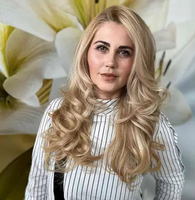 Different Hairstyle Blonde Curled Ends on women with long hair and a side part