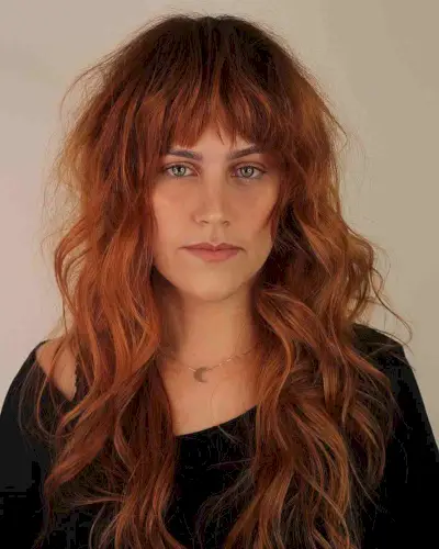 Long Messy Ginger Hair with Bangs for a Long Face