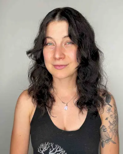 Center-Parted Medium Shag with Soft Curls for Long Face Shapes