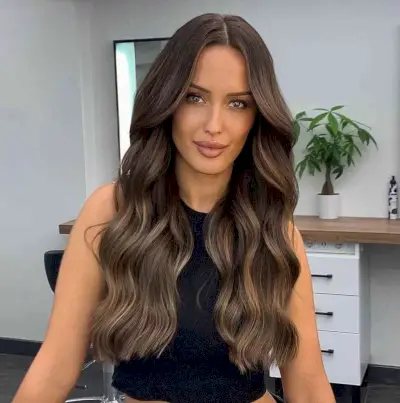 Dimensional Brunette Balayage on Long Wavy Hair for Long Faces