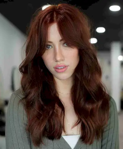 Deep Red Wavy Hair with Bardot Bangs for a Long Face