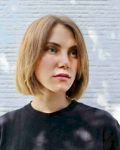 Alluring Blunt Bob with a Subtle Side Part for Long Faces
