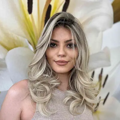 Mid-Length Blonde Hair with Dark Roots for Heart Face Shapes