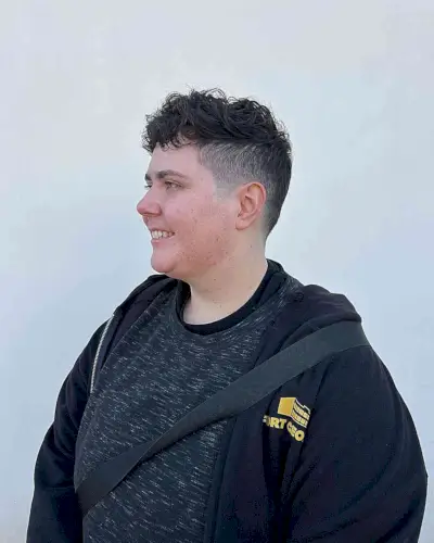 Edgy Androgynous Faded Haircut with Textured Waves