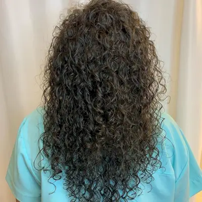 tight spiral perm on long hair