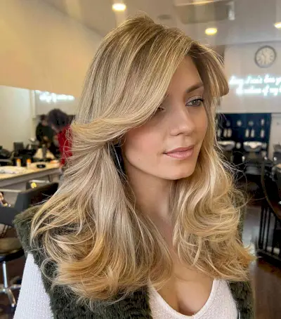 Mid-Length Voluminous Butterfly Blonde Hair with Face-Framing Bangs