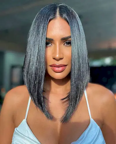 Long Sleek Slob Haircut with a Center Part for women with long faces and straight hair