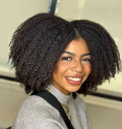 Voluminous Curly Cut with a Middle Part