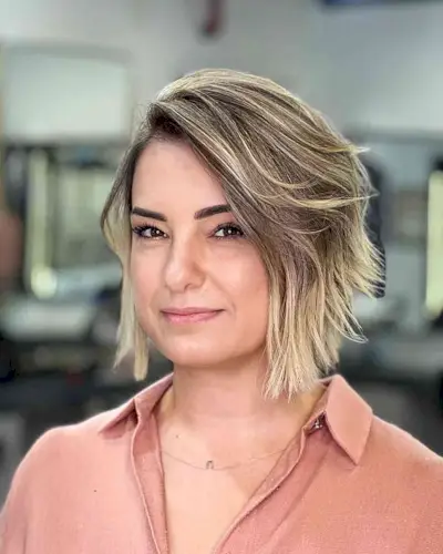 Blunt Dirty Blonde Balayage Bob with a Deep Side Part