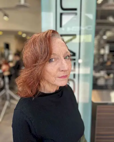 Layered Razor Cut Copper Hair with a Deep Side Part for Ladies Over 70