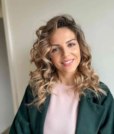 Curled Deeply Side-Parted Hairstyle