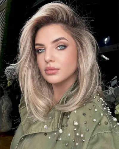 Deeply Side Parted Blonde Hair with Volume