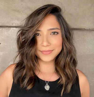 Layered Medium-Length Cut with a Deeper Side Part